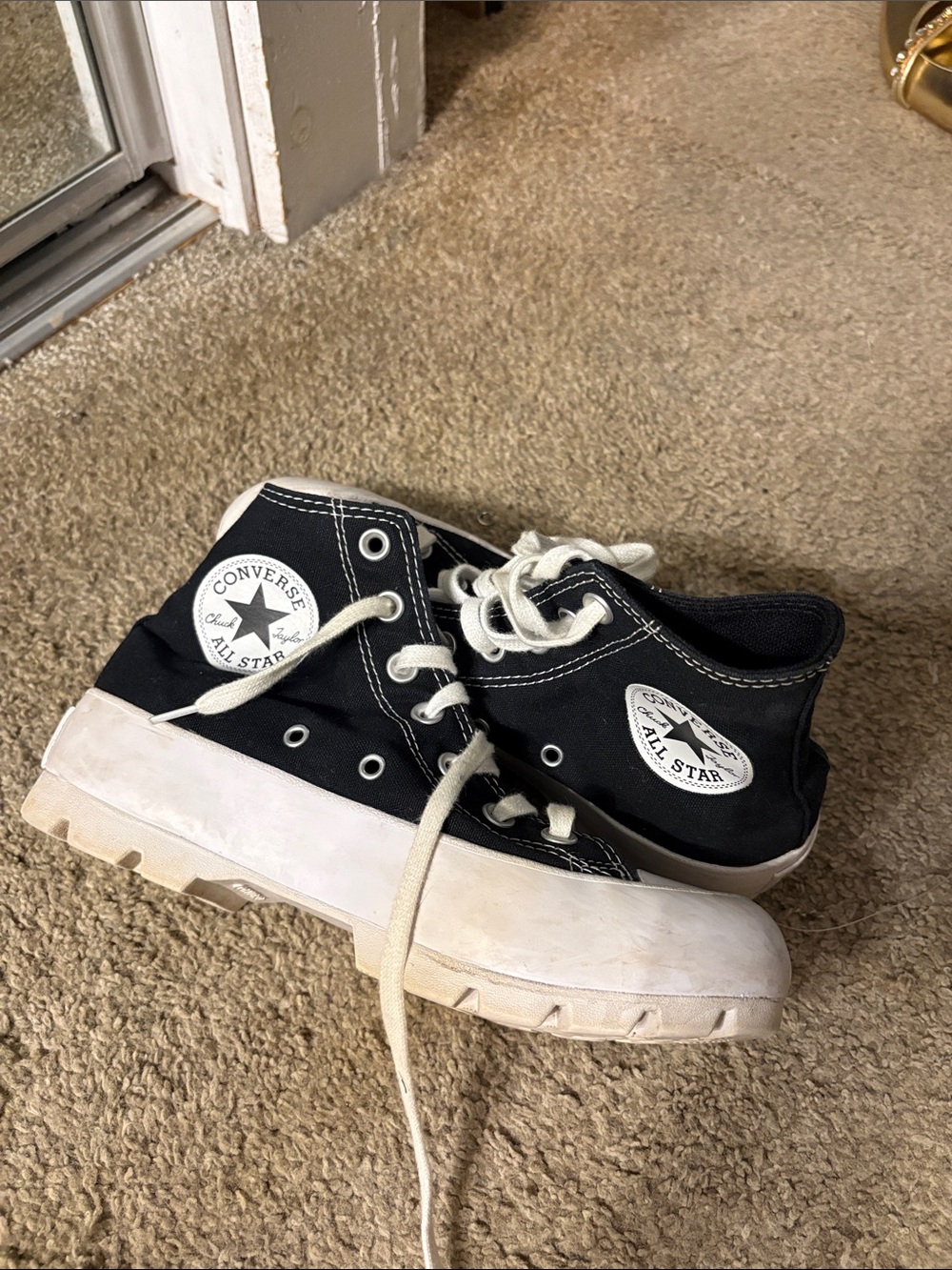 Converse women’s Black Canvas High-Top Platform Sneakers with White Soles